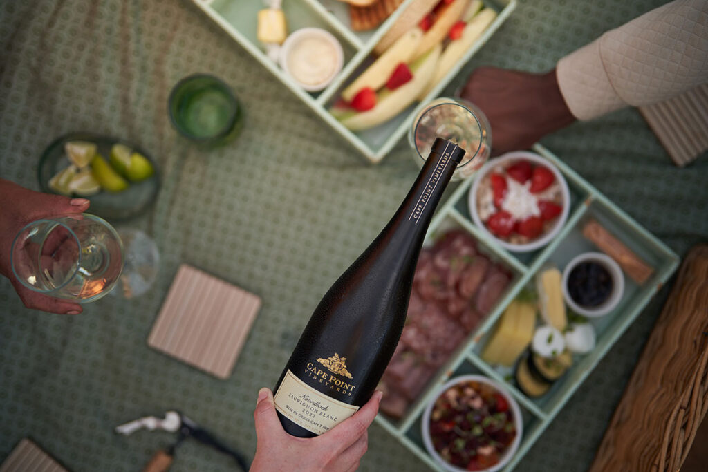 Get outdoors and picnic on the grass at Cape Point Vineyards