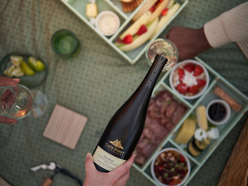 Get outdoors and picnic on the grass at Cape Point Vineyards